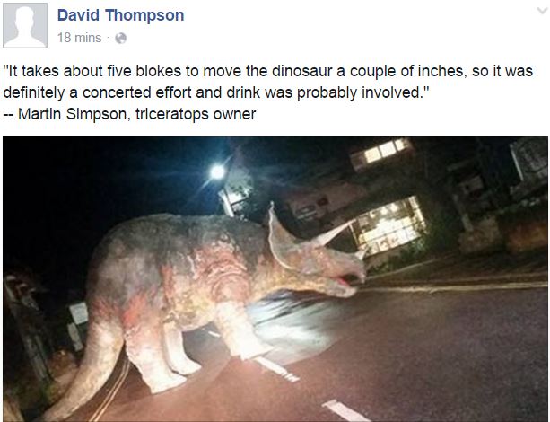 Dinosaur in middle of the road