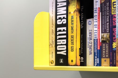 physical books on yellow bookshelf - pixabay 846984
