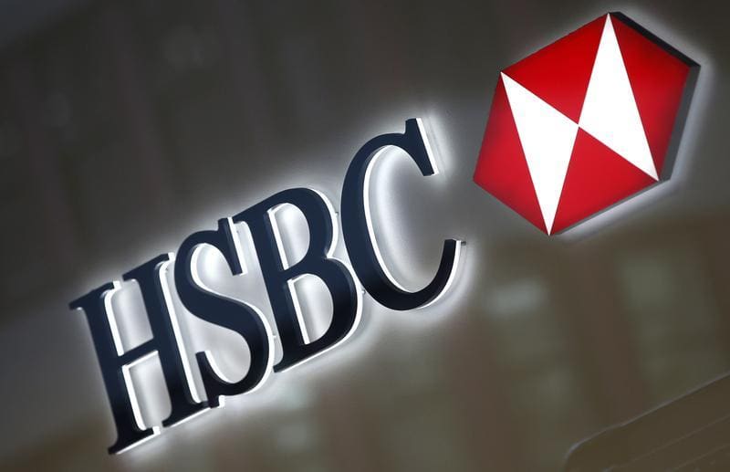 A HSBC logo is seen above the entrance to a HSBC bank branch in New York City