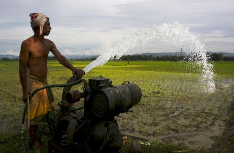 Farmer pumping groundwater
