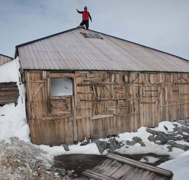 Marty Passingham working on the roof of Mawsons Hut