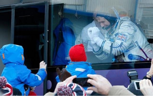 Peake making heart shape to his sons