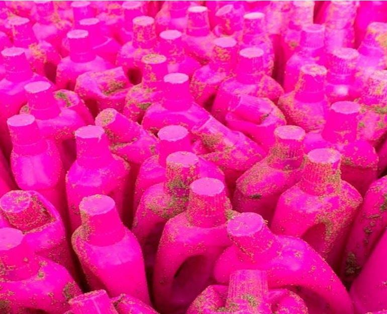 Some of the bright pink detergent bottles washed up on Cornish beach