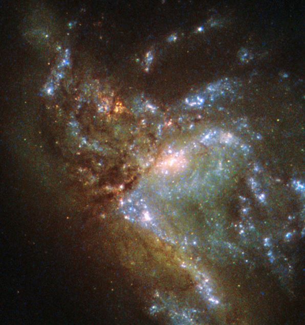 Two galaxies merging and forming a new galaxy