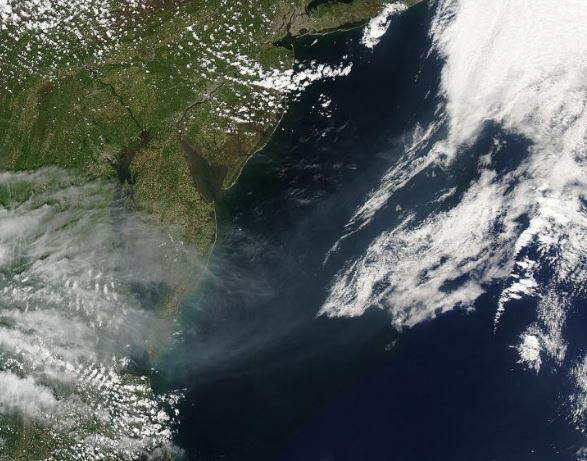 Smoke billowing into the Atlantic Ocean