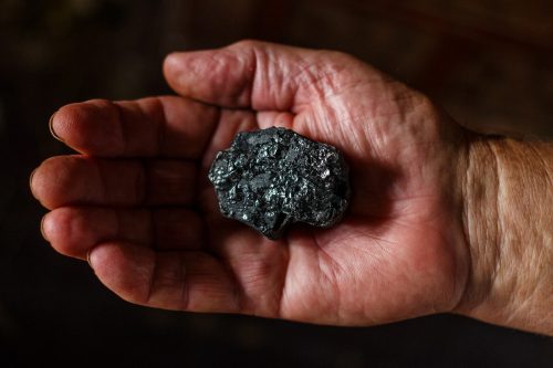 U.S. coal industry - piece of coal in miners hand pixabay-1521718