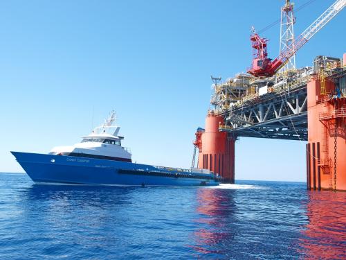 ship passing under sea structure