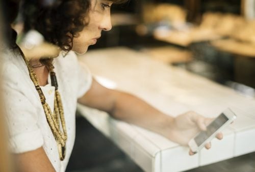 woman looking at smartphone