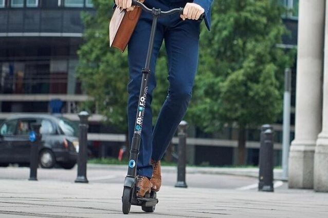 Electric scooters new wave - image of commuter on scooter