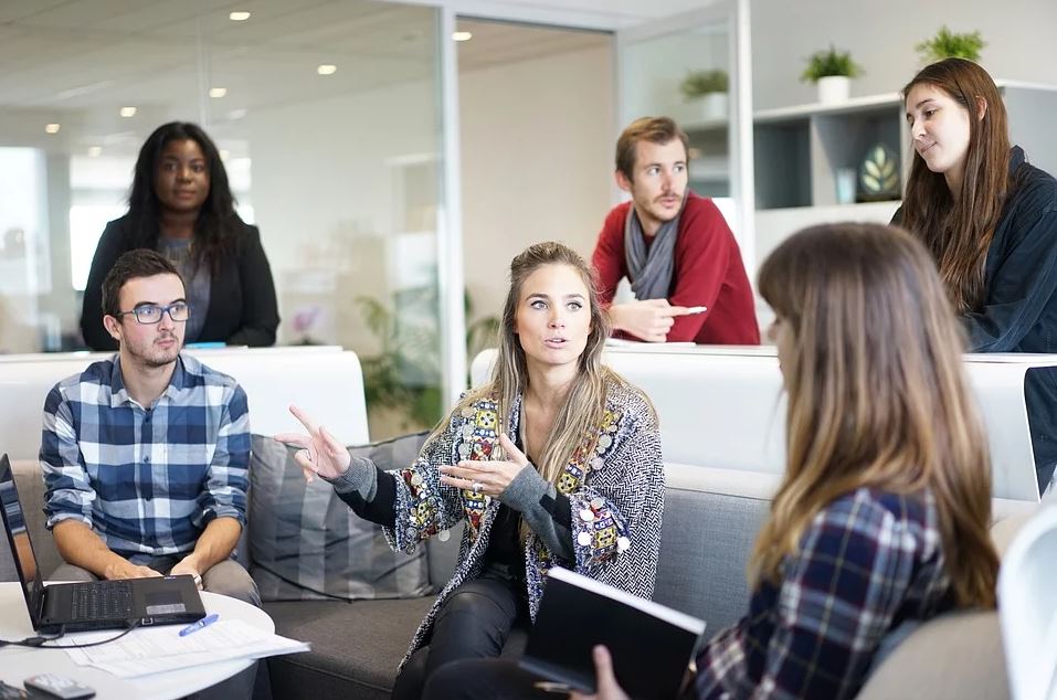 Group of people talking about work - work environment image