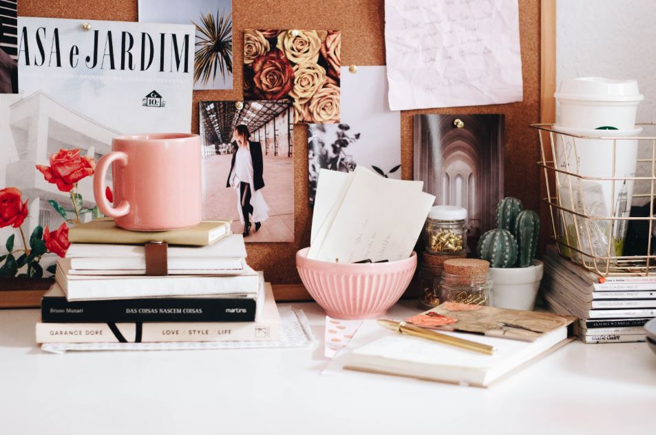 Reinforce positivity - a desk with books and notepad