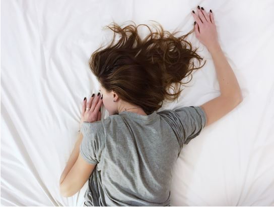 Sleep apnea remedies article - woman in bed asleep