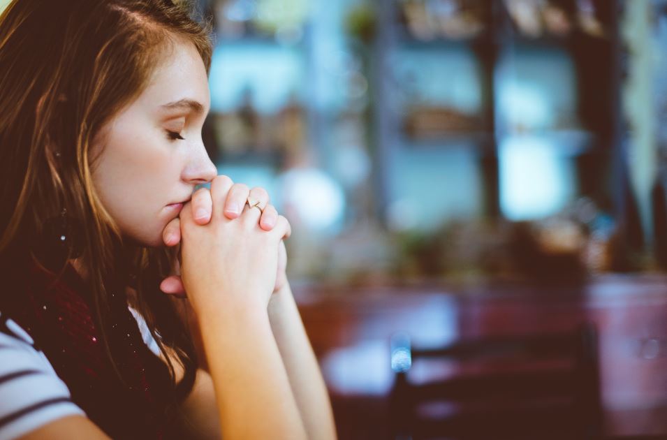 Work to have a healthy mind - a woman meditating