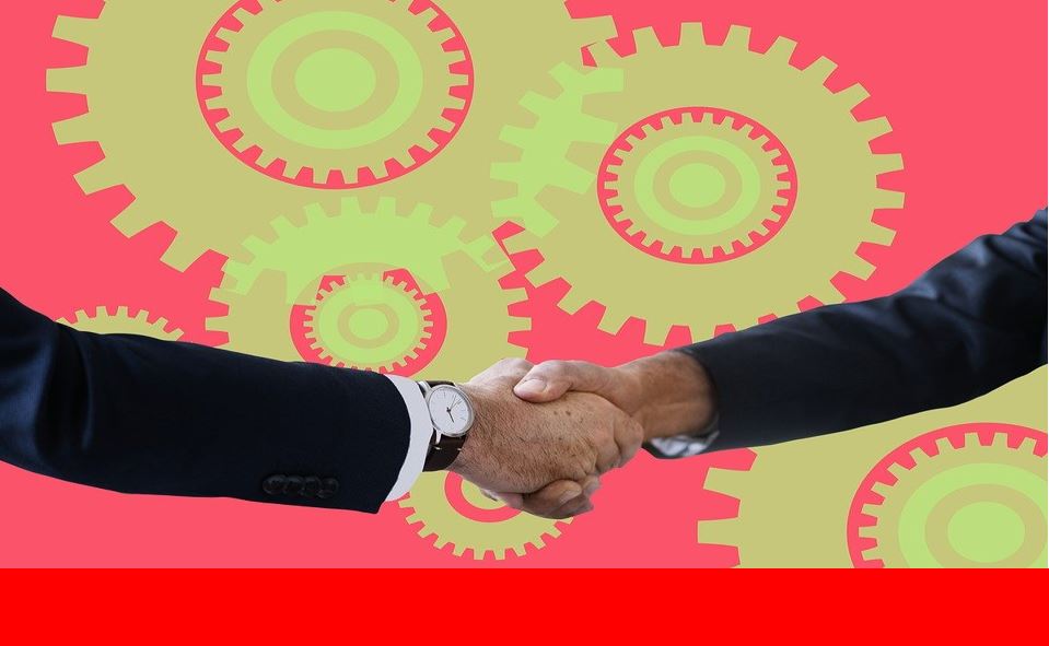 Handshake with cogs in a red background 43