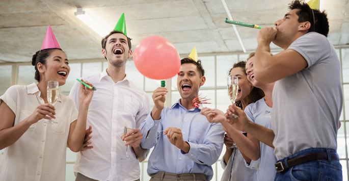 Ways to celebrate a business milestone anniversary - Image of people in a party