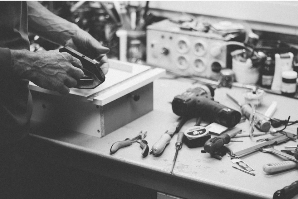 Man with workbench and lots of tools