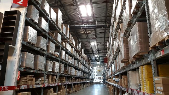 Large warehouse with shelves and boxes - reliable storage article