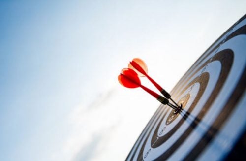 Reaching your target audience - darts hitting bullseye