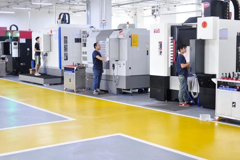 Workers checking machines in a factory - 3993