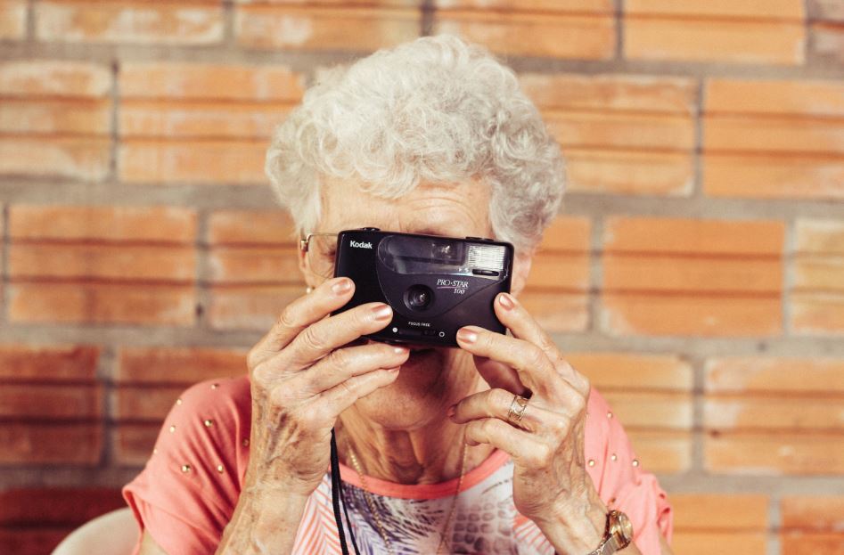Elderly lade using a camera - image 4993