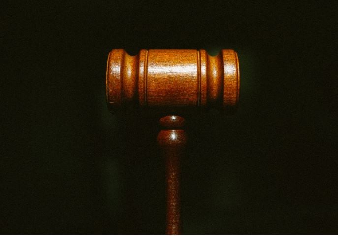 Justice gavel with black background - 398948984