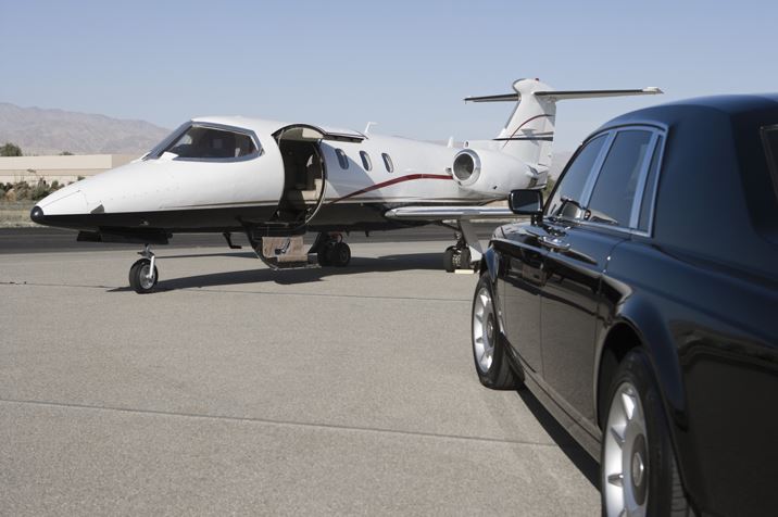 Small plane and car on tarmac - image 4098390890348