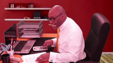 Man Calculating at desk - GIF
