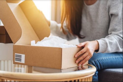 Article about product packaging - person opening a box