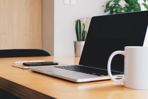 Laptop on a desk - white label services 444