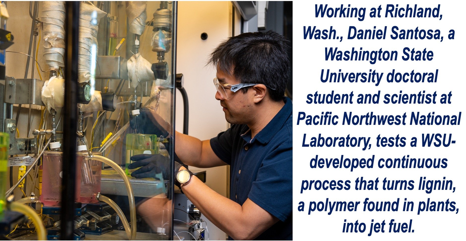 A man wearing goggles working in a lab.