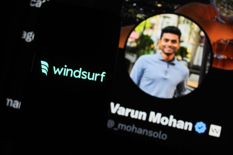 Windsurf logo displayed on a smartphone screen. With windsurf CEO Varun Mohan X profile photo in the background.