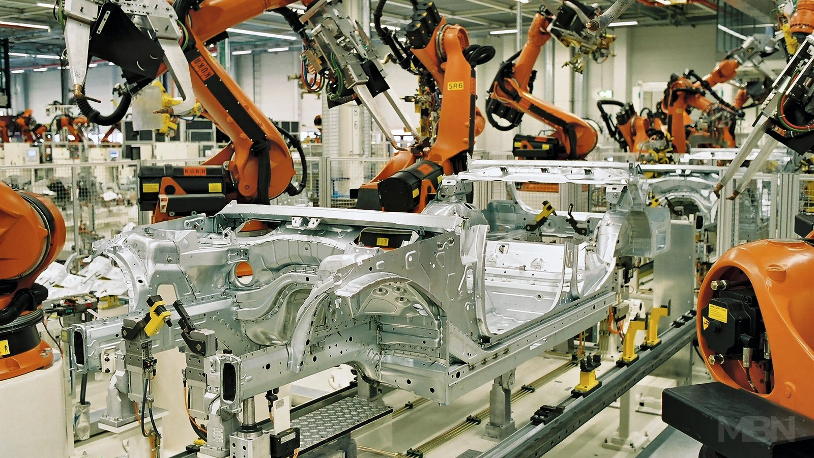 Archive photograph of robotic body welding at BMW’s Leipzig plant in 2005, used to represent German car manufacturing.