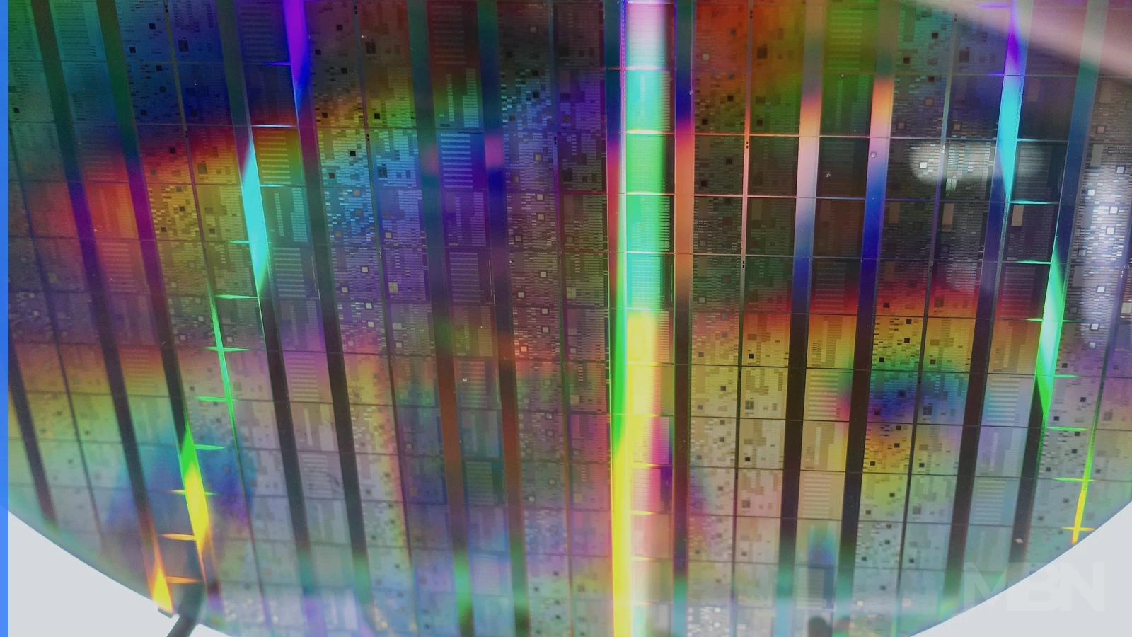 A close-up view of a wafer containing many small quantum-computing chips, used as a representative editorial image.