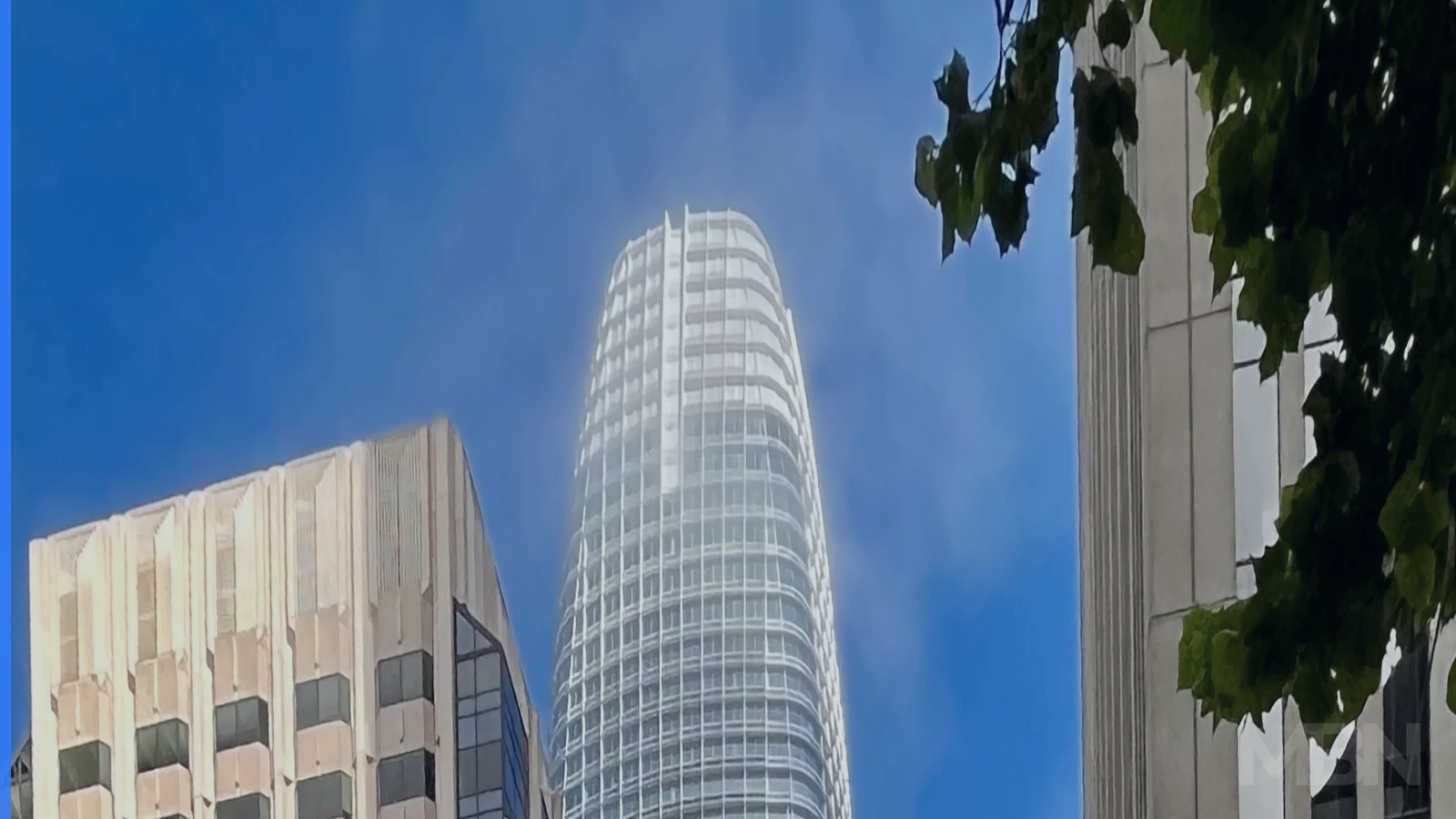 Salesforce Tower rises between downtown San Francisco buildings in a representative editorial photograph.