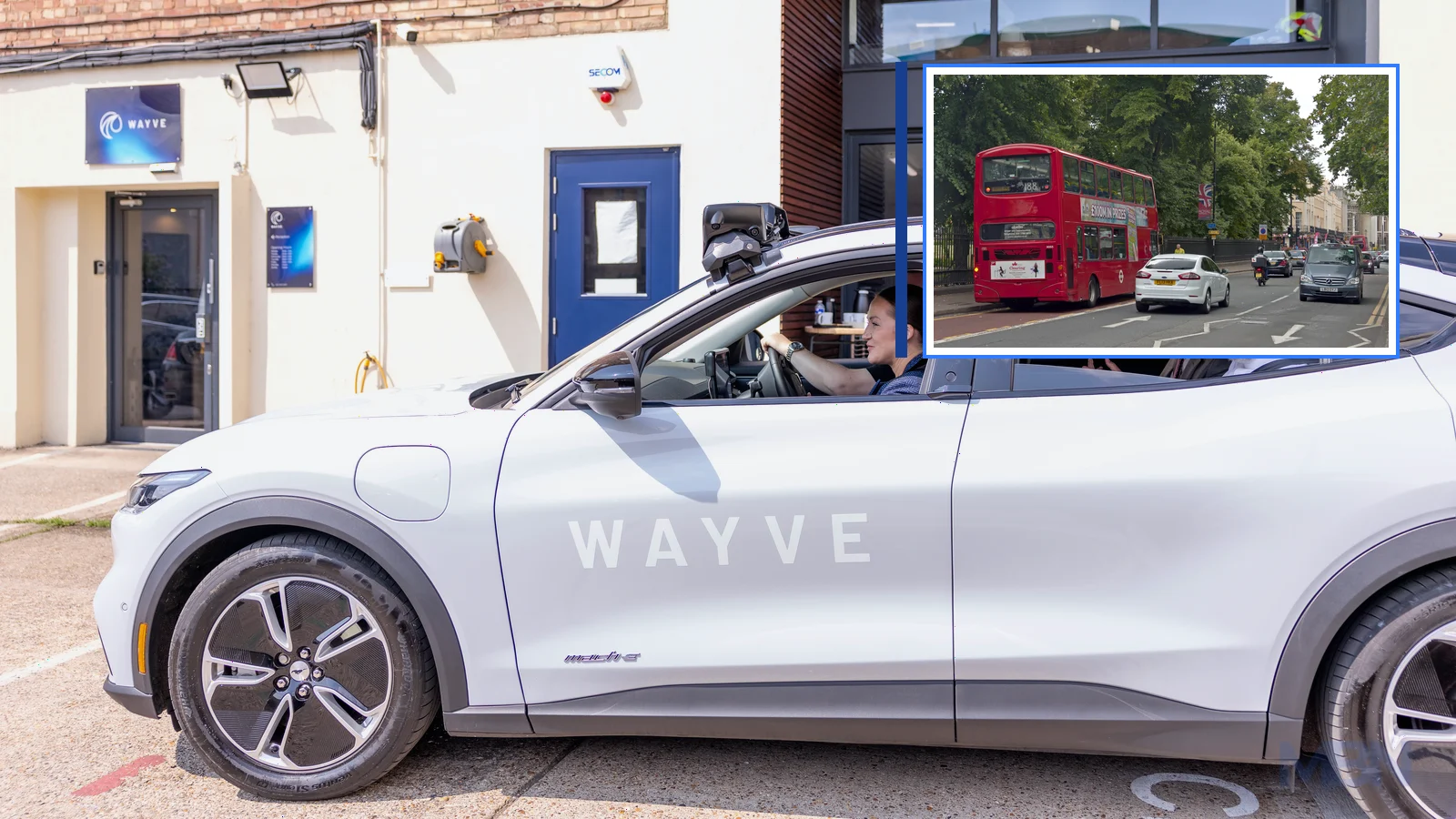 Editorial composite showing a Wayve-branded Ford Mustang Mach-E with roof-mounted sensors and a framed London traffic scene.