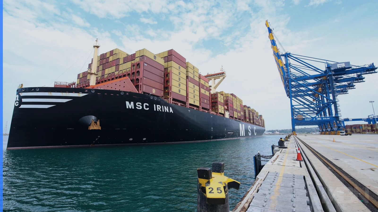 A container ship loaded with multicolored containers approaches a port, used as a representative image of merchandise trade.