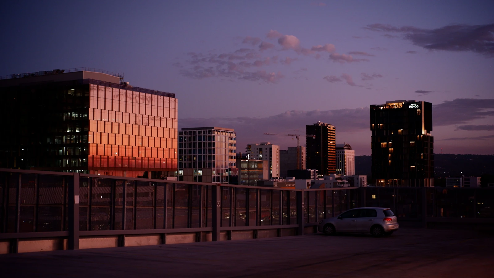 Adelaide city buildings at twilight, with sunset reflections on glass facades, photographed by Thomas Hoang for Pexels.
