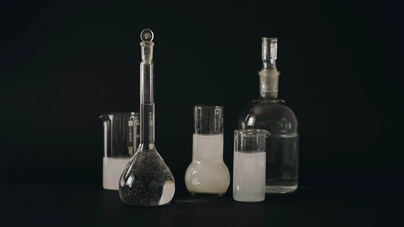 Laboratory glassware containing liquids against a dark background, a representative scene unrelated to the reported materials. Photo by olia danilevich/Pexels.