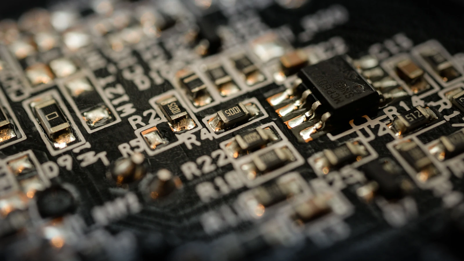 A close-up of chips and connections on a circuit board, a representative stock photograph by ClickerHappy/Pexels.